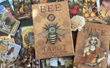 Kristoffer Hughes' Bee Tarot guidebook and deck, with cards displayed