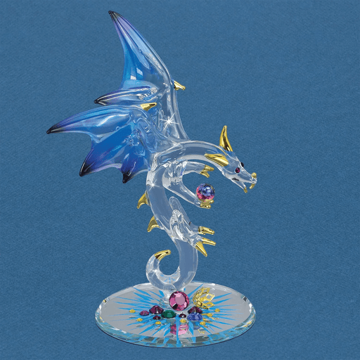 Glass dragon figurien with blue wings and gold horns, claws and spines with jewel treasures