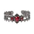Pewter bracelet with red heart stones on a white background