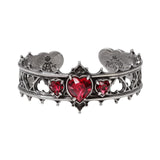 Pewter bracelet with red heart stones on a white background