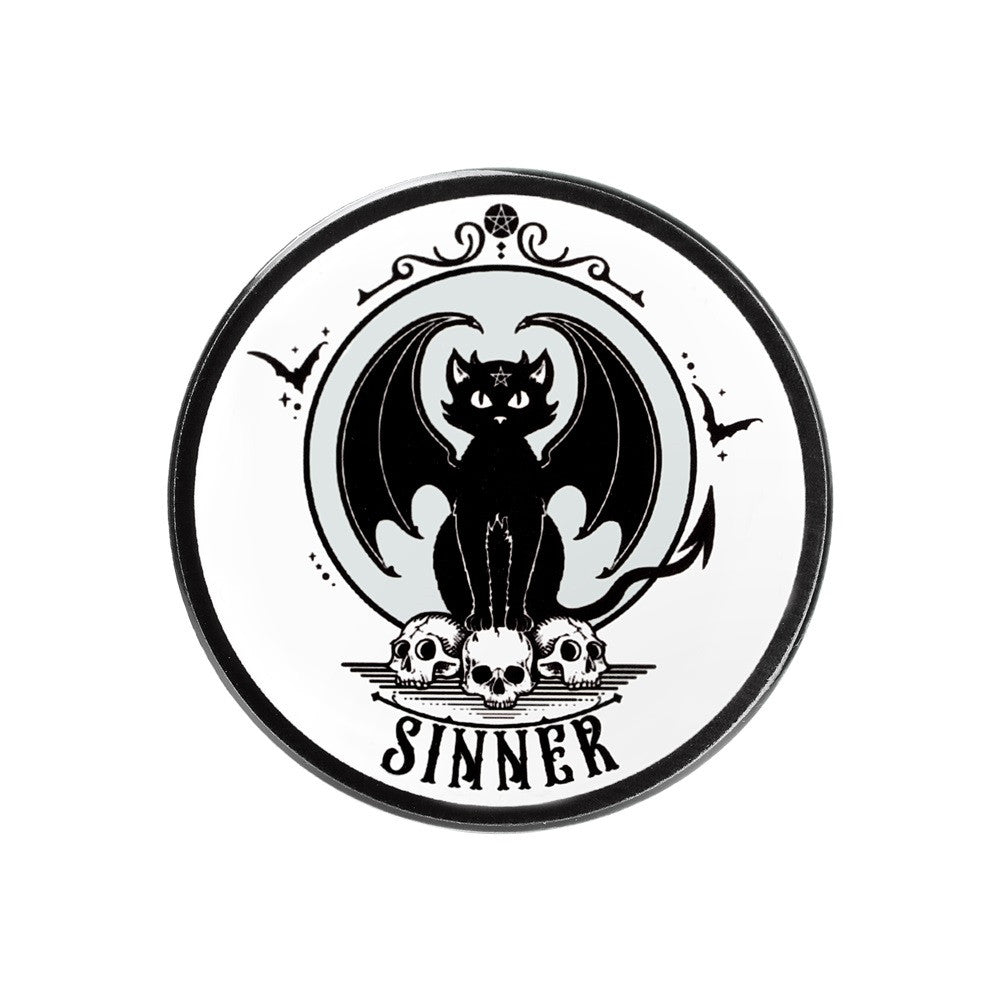 Ceramic coaster, white with black winged cat sitting on skulls with word "Sinner" underneath