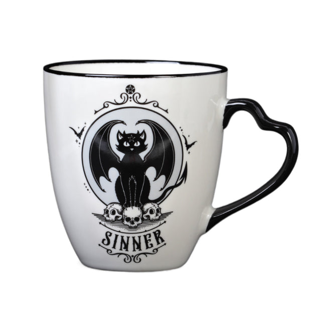 White mug with black design - one side says "Sinner" with devil cat