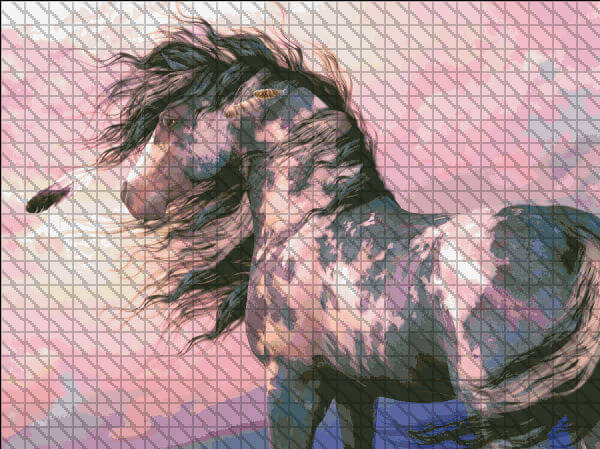 Cross stitch pattern of a pinto horse in front of a sunset, with feathers in its billowing mane