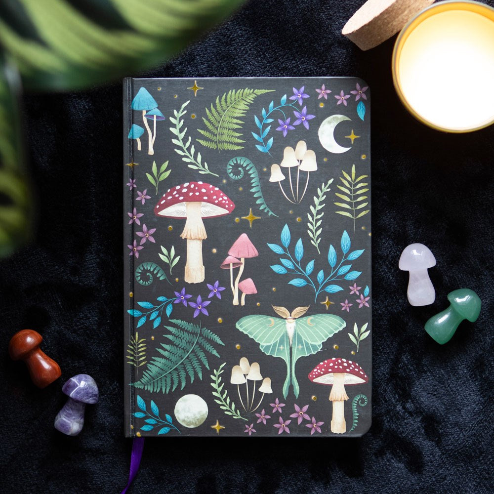 Notebook with mushroom, fern and moon forest-themed design 