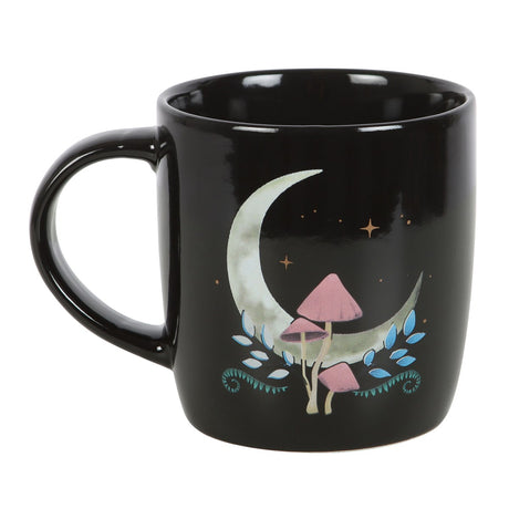 Black ceramic mug with crescent moon and mushroom design