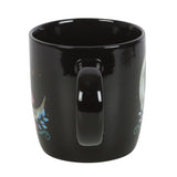 Black ceramic mug with crescent moon and mushroom design