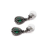 Earrings with skull posts and dangling green crystals