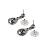Earrings with skull posts and dangling green crystals, back shown