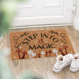Doormat with 'Step into Magic' text on a wooden floor with white sneakers.