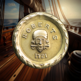 Shiny brass coin with 'Roberts 1721'  and skull