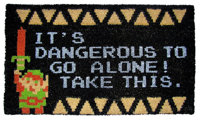 Legend of Zelda doormat featuring pixel Link holding sword up, message of "It's dangerous to go alone! Take this." and triforce triangles