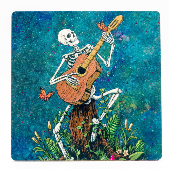 Skeleton playing guitar coaster