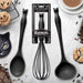 Black cat kitchen utensils, two spoons and whisk