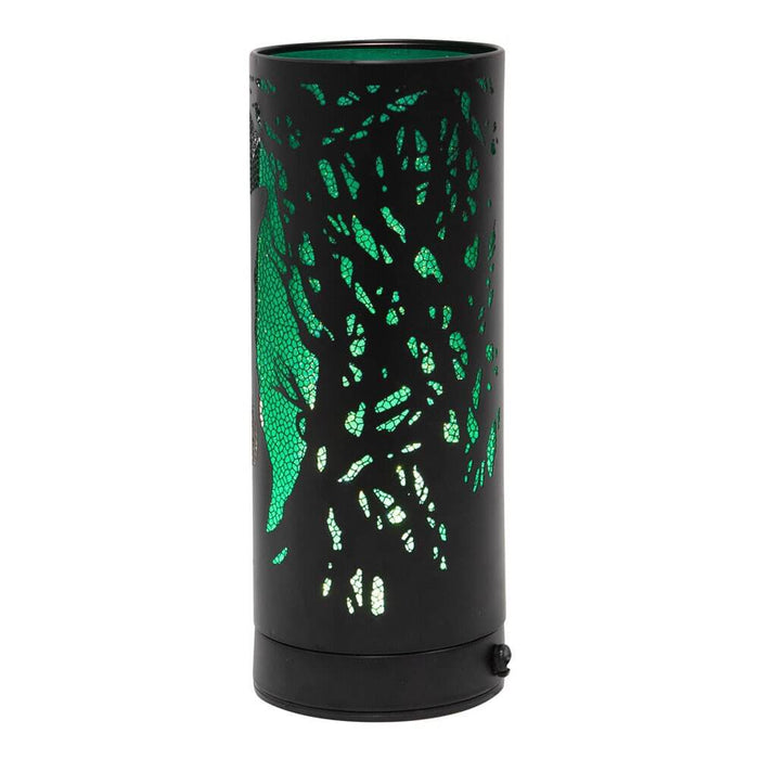 Back of aroma lamp showing tree branch designs upon green