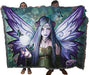 Blanket held by two adults to show large size