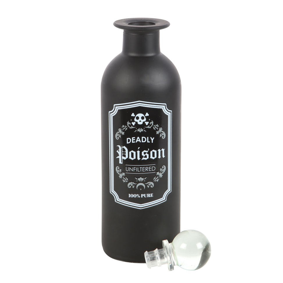 Decorative glass bottle, black with "Deadly Poison, Unfiltered, 100% Pure" label and clear glass stopper