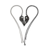 Pair of angel and demon pendants forming a heart shape 