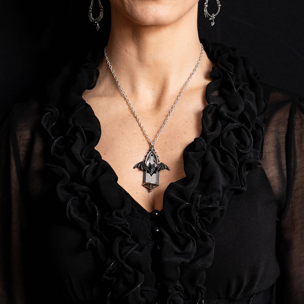 Pewter necklace with a bat and gothic window pendant, shown worn