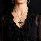 Pewter necklace with a bat and gothic window pendant, shown worn