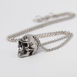 Necklace with a skull charm on a chain
