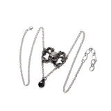 Pewter necklace with a skull and dangling black crystal
