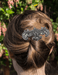 Hojalata barrette shown in hair