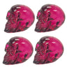 Set of four purple transparent resin skulls