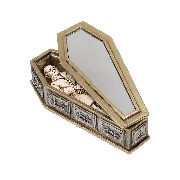 Figurine of vampire in casket with silver and gold resin designs, mirror on inside of casket lid