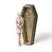 Figurine of vampire in casket with silver and gold resin designs. Shown standing