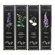 Four black boxes of incense sticks with botanical illustrations and names on a white background