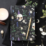 Journal with cover featuring skulls, snakes, bottles, bugs and poisonous plants