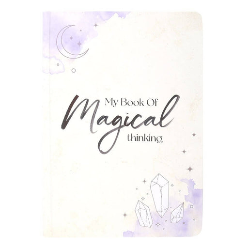 White journal with purple accents, "My Book Of Magical Thinking" with moon and crystals