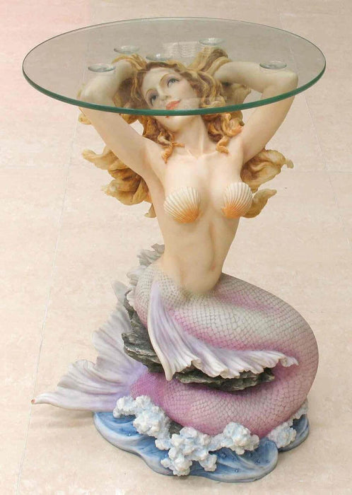 Glass topped mermaid table. Mermaid has blond hair and a pink tail, sitting on waves
