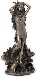 Bronze statue of Aphrodite rising from the sea on a clamshell with a dolphin