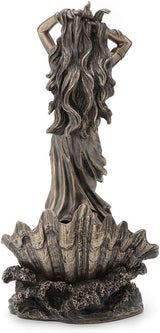 Bronze statue of Aphrodite rising from the sea on a clamshell with a dolphin, shown from the back