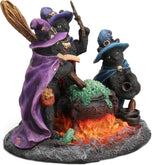 Figurine of three black cats and a frog casting a spell in a bubbling cauldron, dressed in hats and cloaks