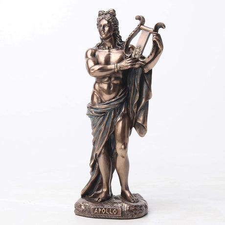 Bronze statue of Apollo holding a lyre on a white background