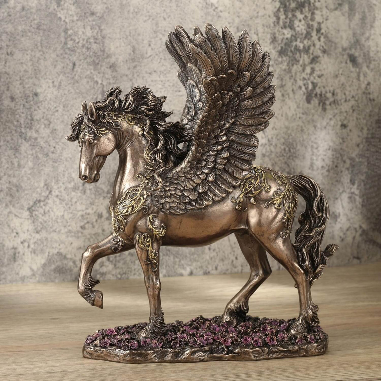 Pegasus figurine - bronze body with gold filigree designs, prancing through pink flowers