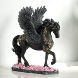 Pegasus figurine - black body with gold filigree designs, prancing through pink flowers