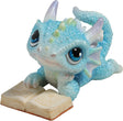 Blue dragon figurine with an open book