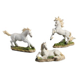 Three white horse figurines in different poses on a white background