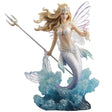 Mermaid fairy figurine with a trident and seashell bursting out of the waves