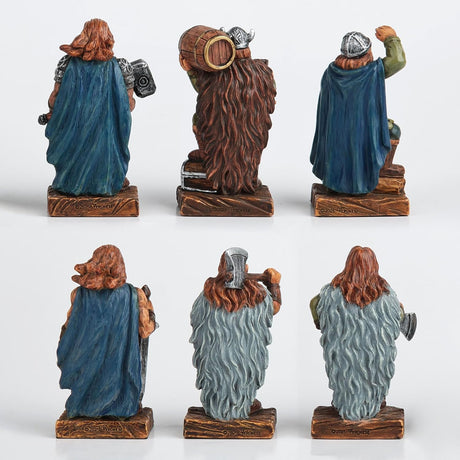 Set of six decorative Viking figurines in various poses with weapons, shown from the back