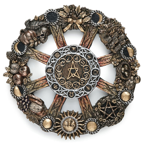 An ornate circular occult wheel wall plaque featuring a central pentagram and astrological symbols, surrounded by detailed seasonal elements including harvest food, plants and animals, and moon phases.
