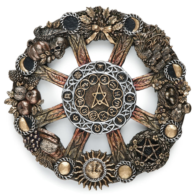 An ornate circular occult wheel wall plaque featuring a central pentagram and astrological symbols, surrounded by detailed seasonal elements including harvest food, plants and animals, and moon phases.