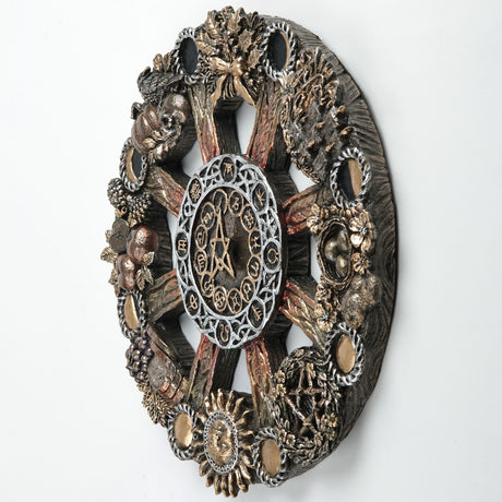 An ornate circular occult wheel wall plaque featuring a central pentagram and astrological symbols, surrounded by detailed seasonal elements including harvest food, plants and animals, and moon phases.