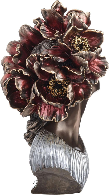 Bronze bust of a woman with red flowers for hair. Shown from the side