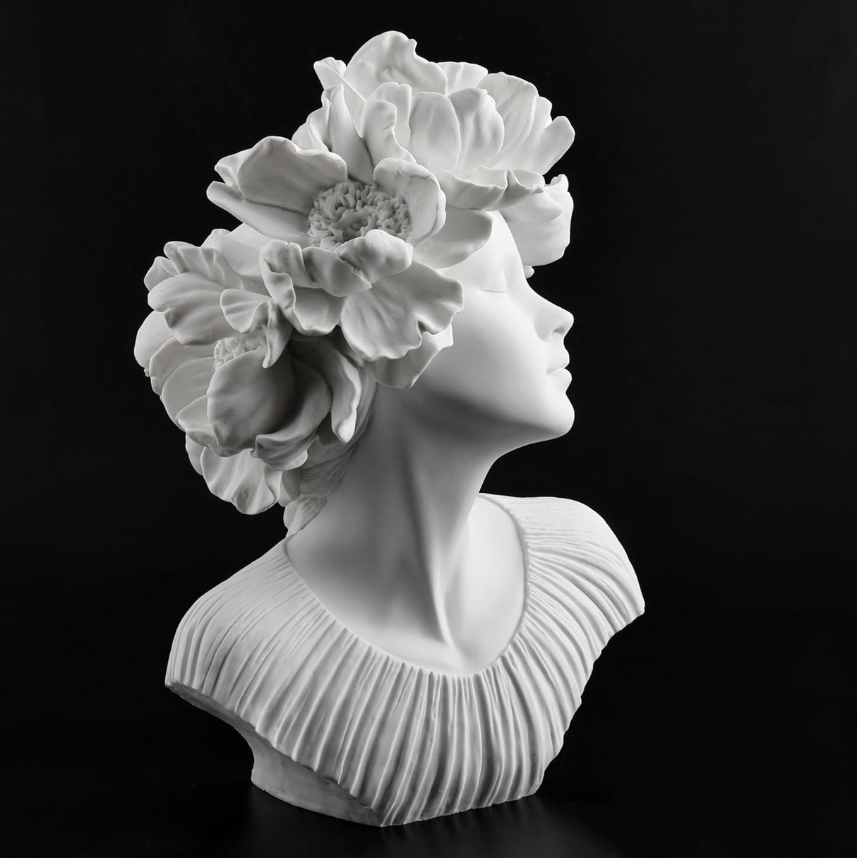 White bust of a woman with flowers for hair