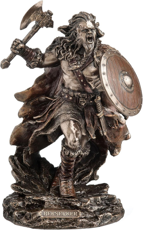 Statue of a Viking warrior holding a shield and axe with 'Berserker' written on the base