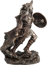 Statue of a Viking warrior holding a shield and axe , shown from the side